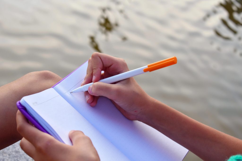 woman writing in journal