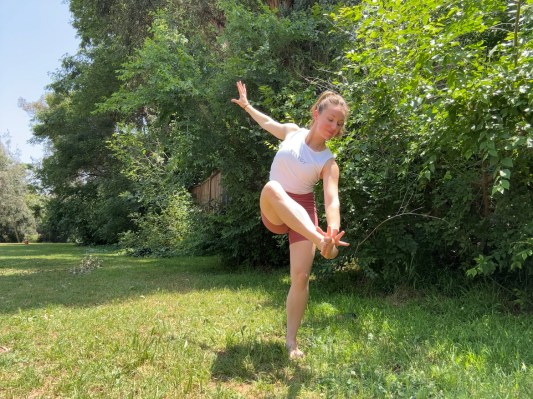 Personal trainer demonstrating out-cross-out-hit exercise