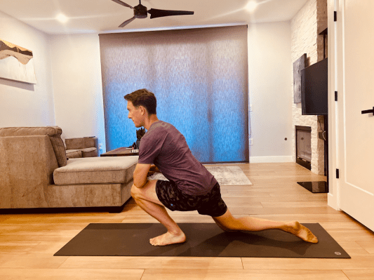 Physical therapist demonstrating calf stretch