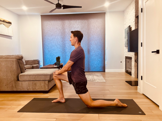 Physical therapist demonstrating hip flexor stretch 