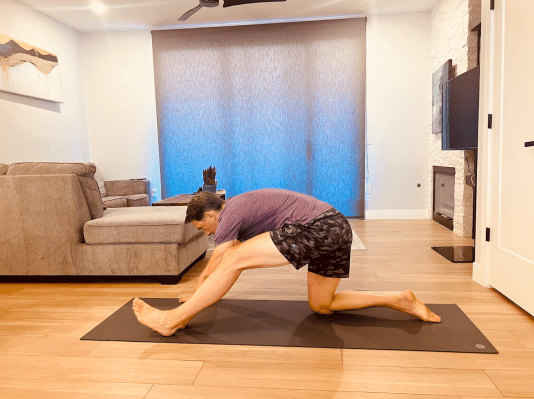 Physical therapist demonstrating hamstring stretch 