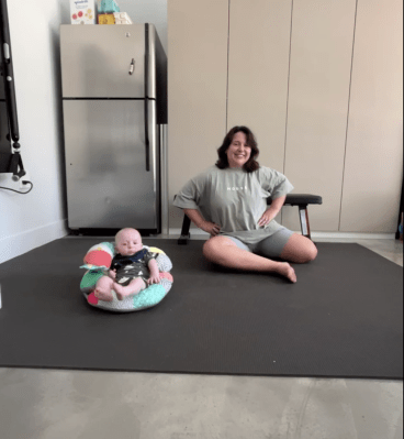 Person doing ground get up exercise on exercise mat