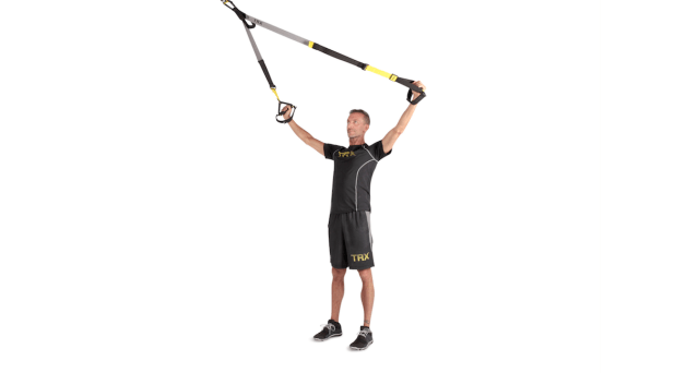 Person demonstrating TRX Y-fly as part of a TRX workout