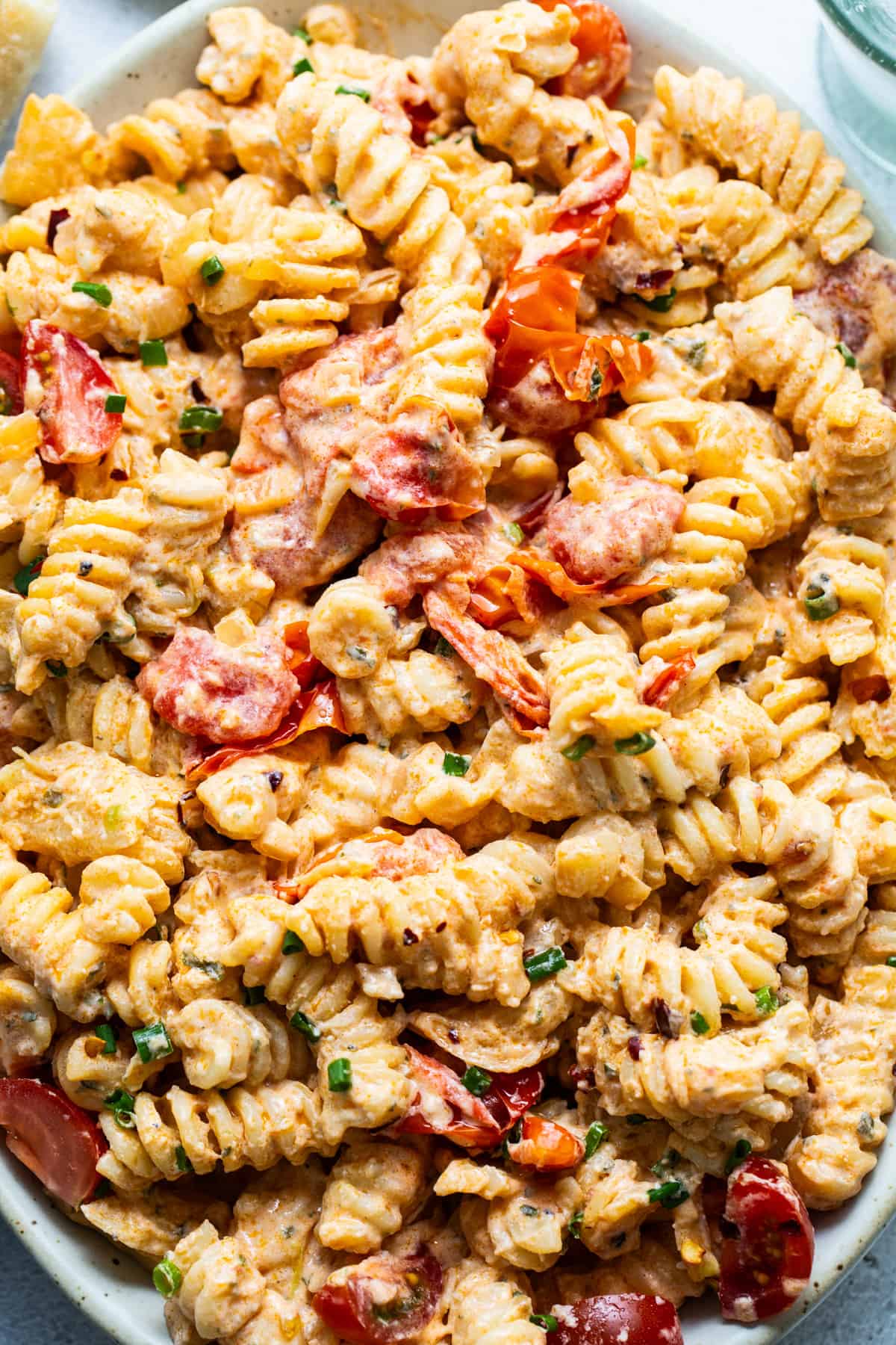 Creamy pasta salad with shrimp and diced vegetables.