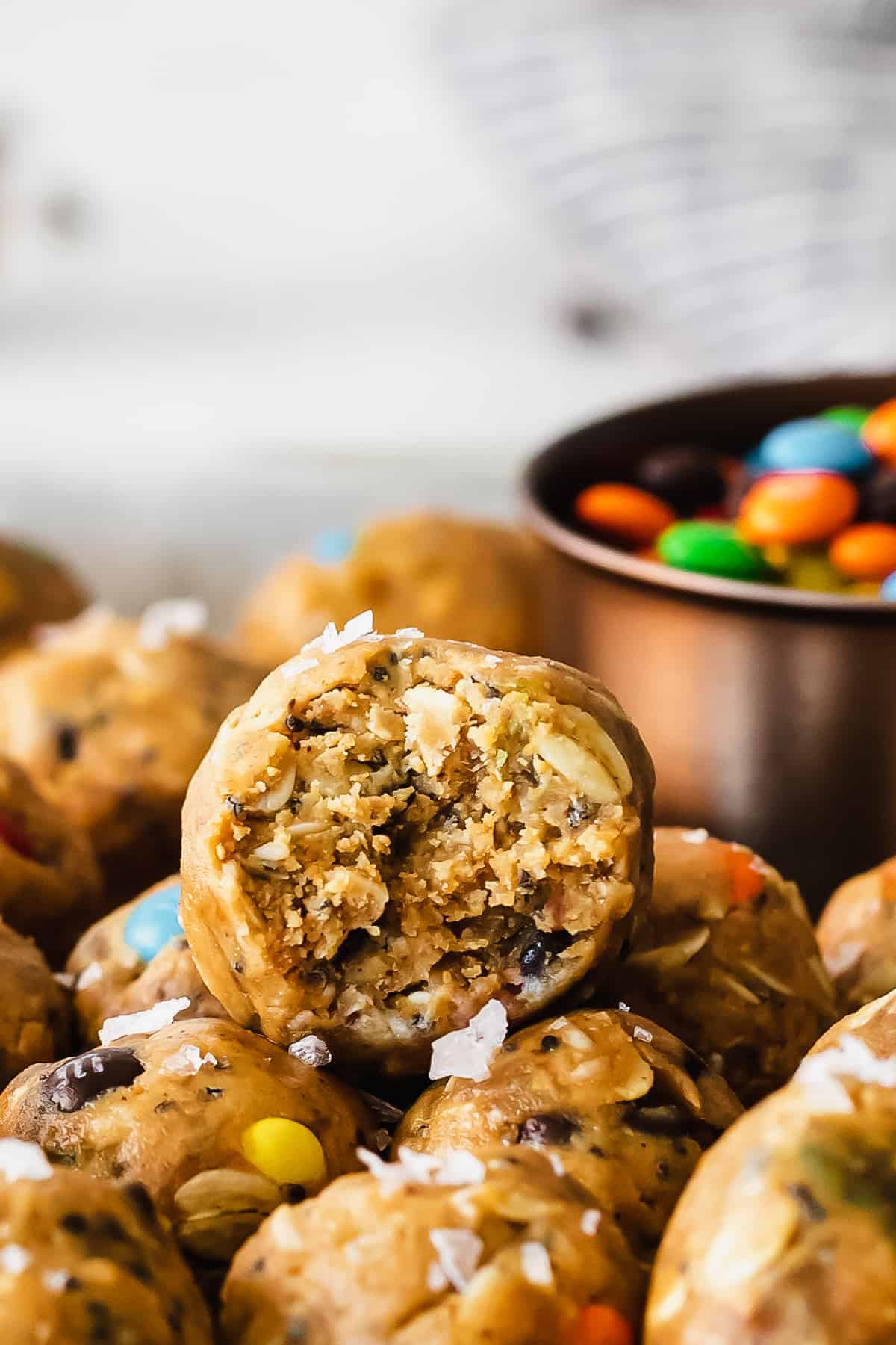 Oatmeal cookie bites with a bite taken out of them.