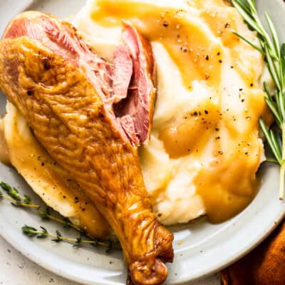 Smoked turkey leg in mashed potatoes.