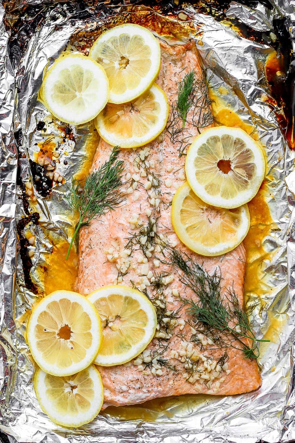 Baked salmon fillet on a baking sheet.