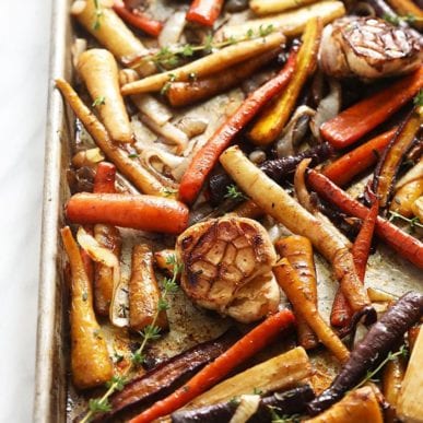 roasted carrots and garlic on a baking tray