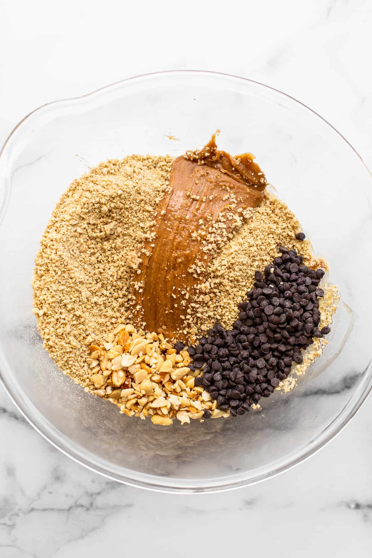 Ingredients for no bake peanut butter bars in a bowl.