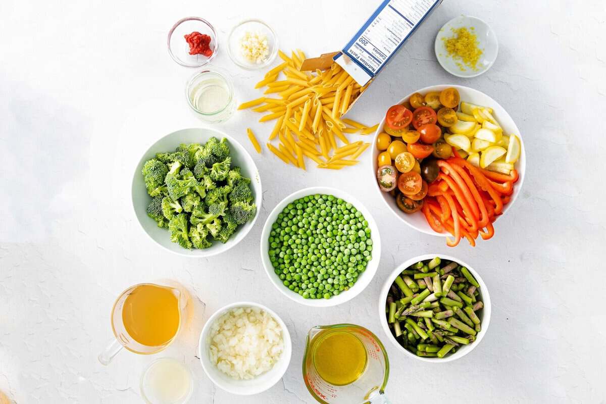 pasta primavera ingredients in bowls, ready to be prepared