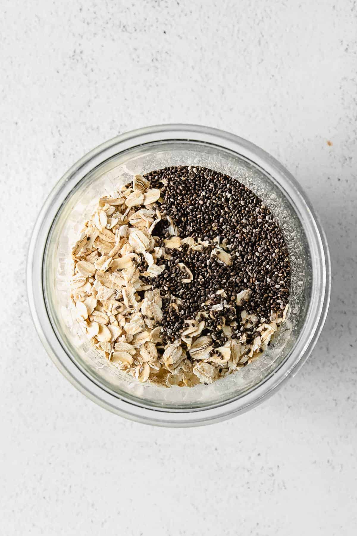 brown sugar shaken espresso overnight oats mixed together in a glass jar ready to refrigerate