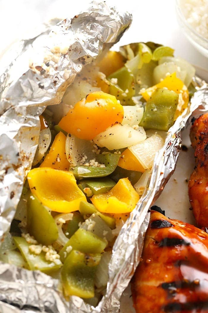 Easy grilled peppers and onions in a foil pack on a plate