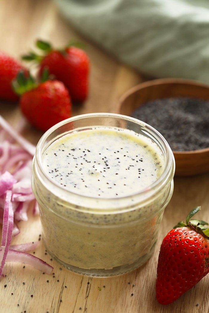 Easy homemade poppyseed dressing made with Greek yogurt and lemon A jar of homemade poppy seed dressing for strawberry spinach salad.