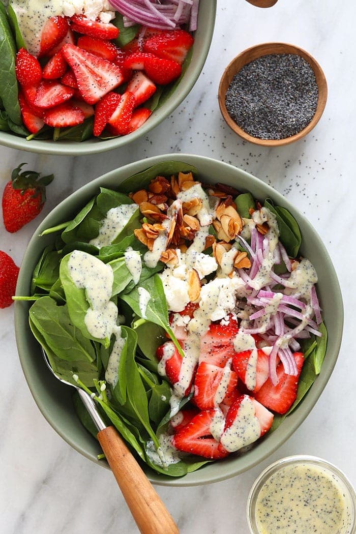 Strawberry spinach salad loaded with fresh berries, feta, and candied almonds Strawberry Spinach Salad with Chia Seeds.