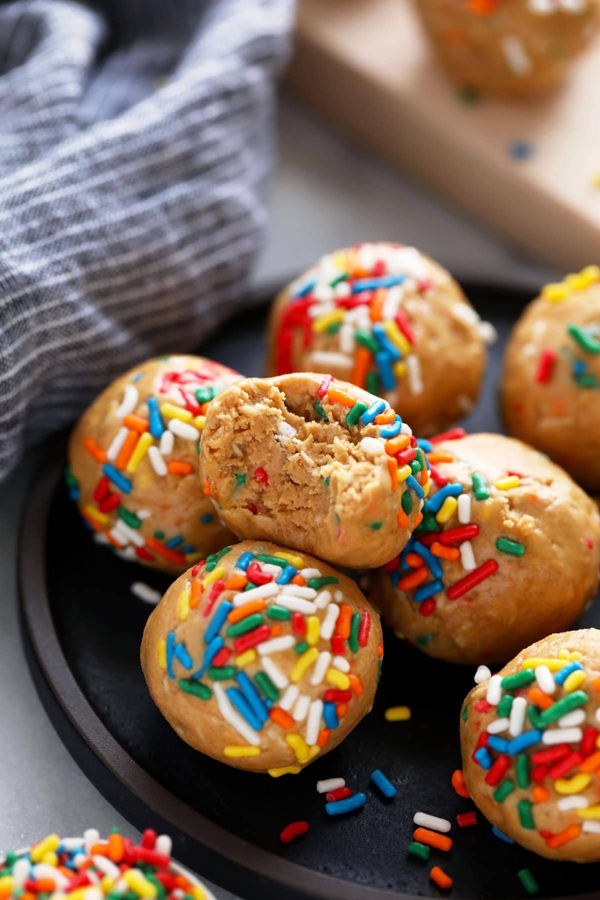 birthday cake protein ball cut in half showing soft interior with sprinkles