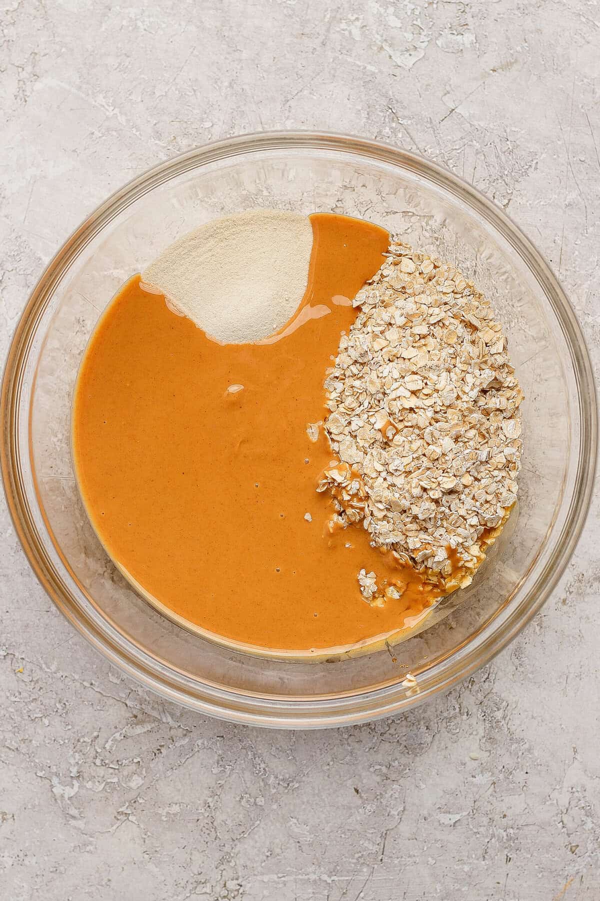 peanut butter oats and protein powder in a mixing bowl for crumble topping