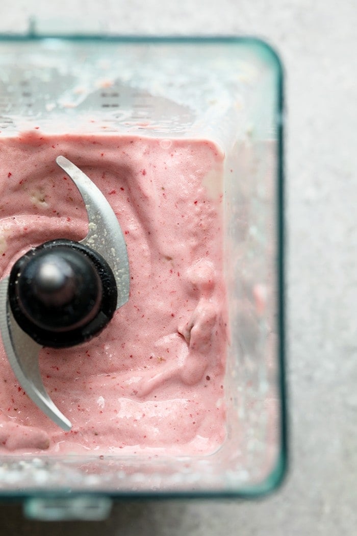 strawberry cheesecake protein smoothie with fresh strawberries