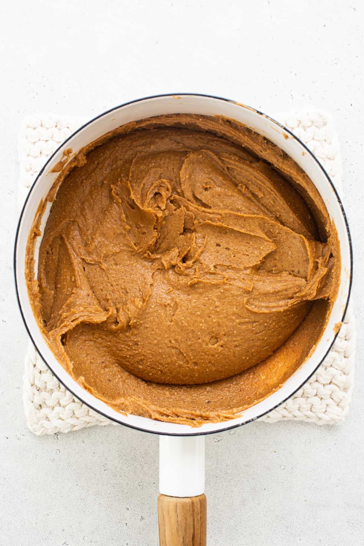 Peanut butter caramel mixture in a skillet.
