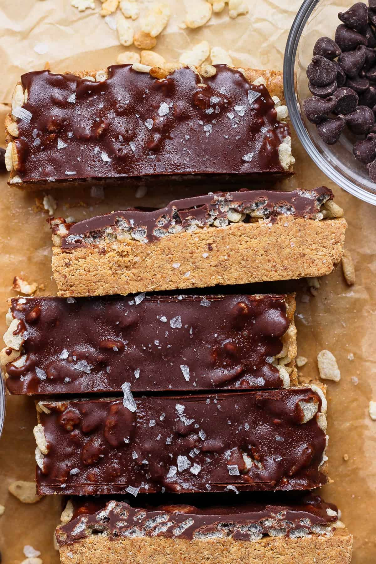 Close-up of cut maple almond butter bars with chocolate and crispy rice cereal.