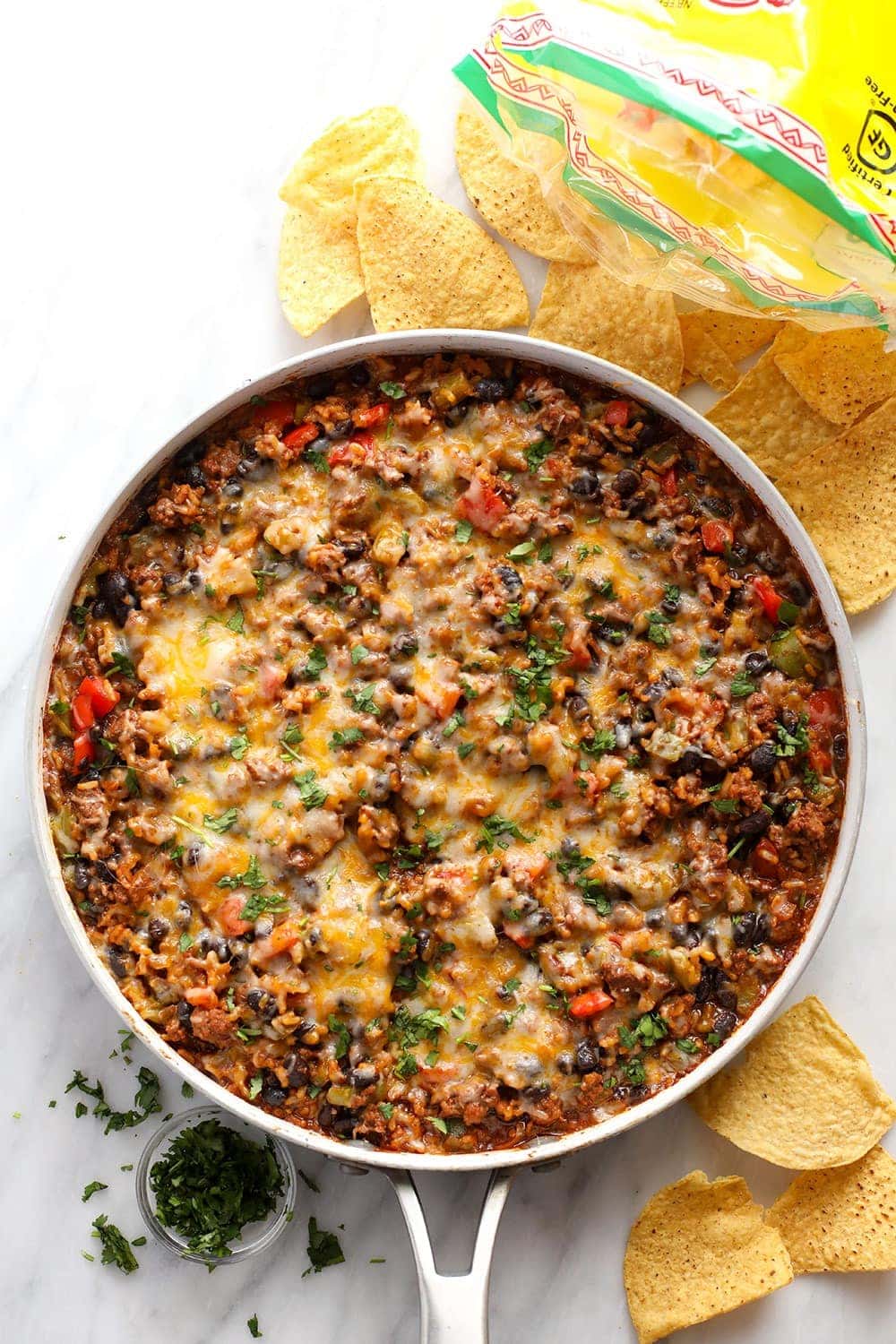 Whether you make this on game day or eat it as a main meal, this Mexican Beef Skillet requires one pan only and only 40 minutes of your time! beef skillet in skillet.