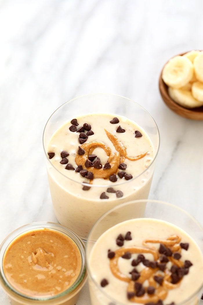 Thick peanut butter banana smoothie in a glass